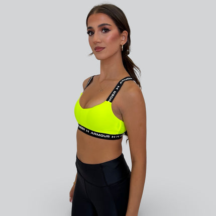 Under Armour women’s crossback low-support sports bra in high-vis yellow with black elastic band