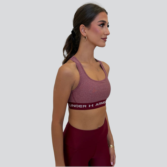 Under Armour women’s crossback mid-support sports bra in red and pink