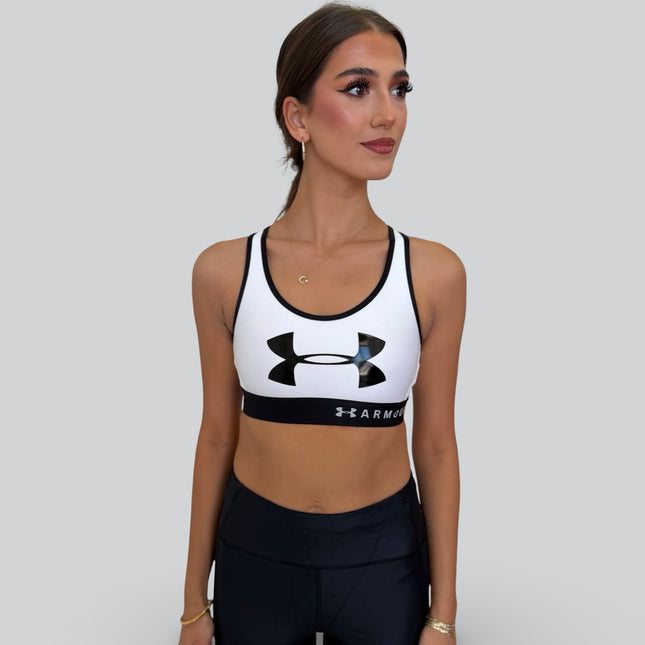 Under Armour women’s mid-support keyhole sports bra in white and black